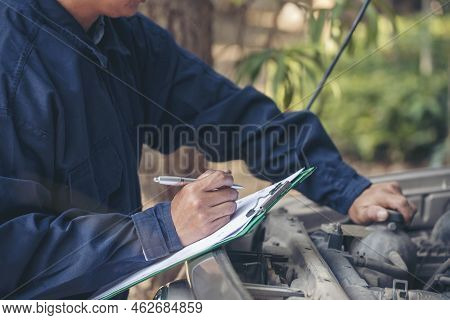 Mechanic Car Service Auto Garage In Automotive Mobile Center. Technician Workshop Repair Engine Moto