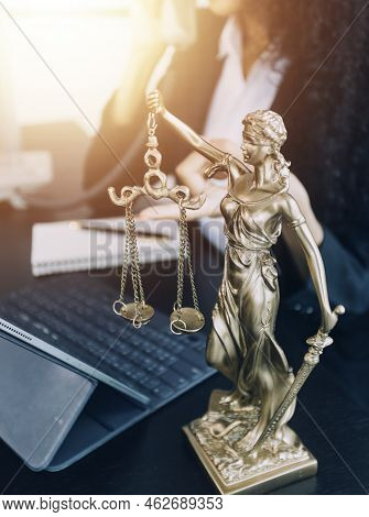 Justice And Law Concept.male Judge In A Courtroom On Wooden Table And Counselor Or Male Lawyer Worki