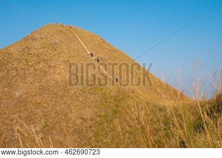 Traveler Hiking Enjoying In The Mountains With Backpack At Khao Chang Puak Mountain Thailand.