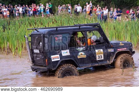 Russia - August 12, 2023, Tver. The Car Overcomes Difficult Obstacles. Large-scale Sports Competitio