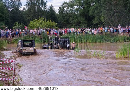 Russia - August 12, 2023, Tver. The Car Overcomes Difficult Obstacles. Large-scale Sports Competitio