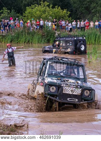 Russia - August 12, 2023, Tver. The Car Overcomes Difficult Obstacles. Large-scale Sports Competitio