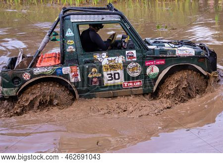 Russia - August 12, 2023, Tver. The Car Overcomes Difficult Obstacles. Large-scale Sports Competitio