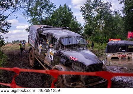 Russia - August 12, 2023, Tver. The Car Overcomes Difficult Obstacles. Large-scale Sports Competitio