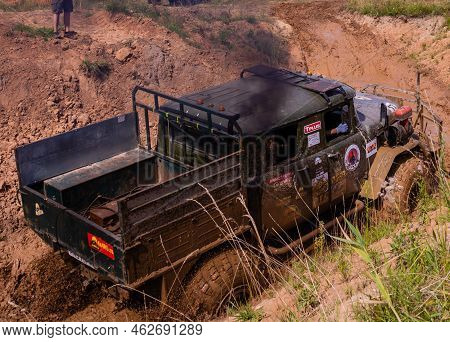 Russia - August 12, 2023, Tver. The Car Overcomes Difficult Obstacles. Large-scale Sports Competitio