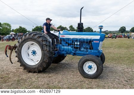 Ilminster.somerset.united Kingdom.august 21st 2022.a Restored Ford 5000 Tractor Is Being Driven Arou
