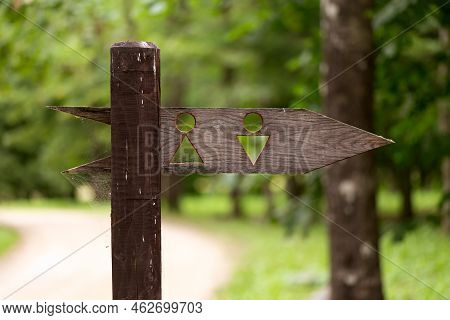 Wooden Womens And Mens Logos Toilet, Water Closet Sign In Public Park