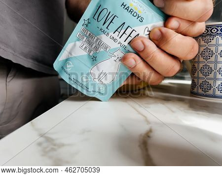 Paris, France - Sep 13, 2022: Pov Male Hand Holding Pouch With Hardys Love Affair Kalb Und Pute Wet 