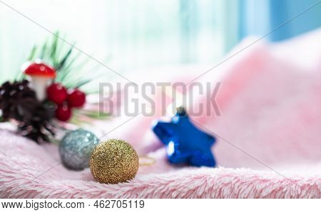Golden And Silver Christmas Ball On Pink Sweater With Overlight From Window Background,for Merry Chr