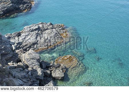 Rock Formation Entering The Waters Of The Mediterranean Sea In The Town Of Almuñecar, Spain