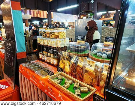 North Jakarta, Indonesia - September 24, 2022: A Woman Is Selling Traditional Indonesian Snacks At T
