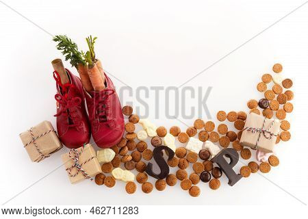 Saint Nicholas - Sinterklaas Day With Shoe, Carrot And Traditional Sweets On White Background
