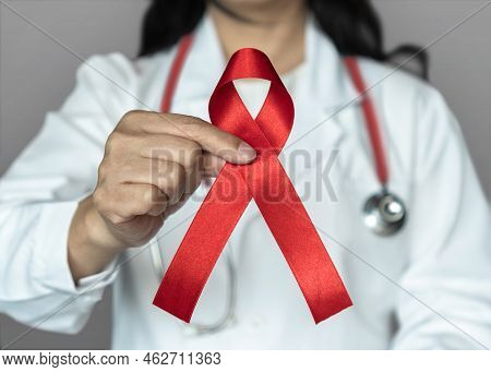 World Aids Day And National Hiv Aids And Ageing Awareness Month In December With Red Ribbon On Medic
