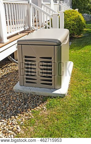 Residential Standby Generator On A Concrete Pad