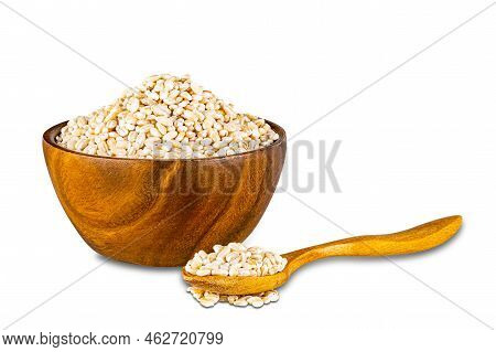 View Of Dry Pearl Barley In Wooden Bowl And In Wooden Spoon On White Background With Clipping Path.