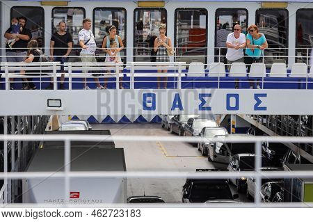Thassos, Greece - August 25, 2022: Ferryboat Taking People And Their Cars From Continental Greece To