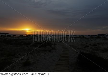 Summer Sunrise Over Golden Beach (skala Potamias) In Greece With An Overcast Sky.