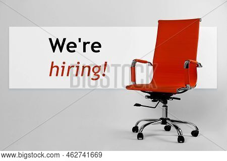 We`re Hiring! Red Office Chair On Light Grey Background
