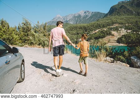 Young Dad And His Son Standing On Mountain View. Child Kid Boy Having Fun With Father And Hiking Hik