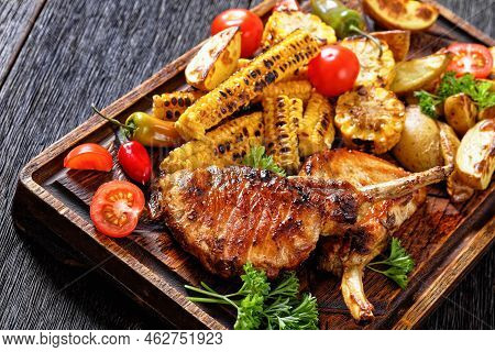 Bbq Tomahawk Pork Chops, Bone-in Steak With Grilled Corn Disks And Corn Ribs, Wedges Potatoes, Fresh