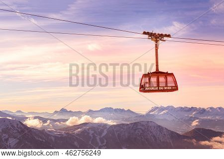 Chamonix Mont Blanc, France - January, 28, 2015: Cable Car Cabin At Aiguille Du Midi And Pink Sunset