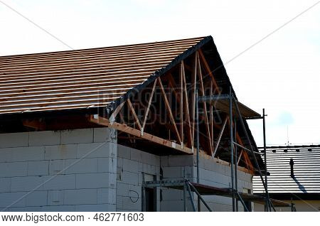 The Trusses Are Made From High-quality, Strength-graded Lumber And Connected By Steel Buttplates Wit