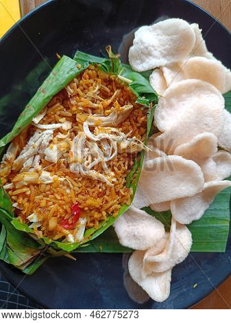 Top View Shoot Of Chicken Grilled Rice With Crackers Served On Banana Leaves