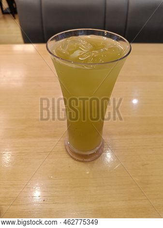 Green Ocha Tea Drink With Ice Served In A Restaurant