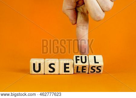 Useful Or Useless Symbol. Concept Words Useful Or Useless On Wooden Cubes. Businessman Hand. Beautif