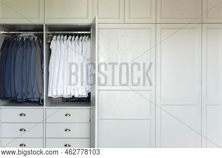 Male Wardrobe Furniture For Business Clothing Neatly Storage Organization. Man Closet With Garment