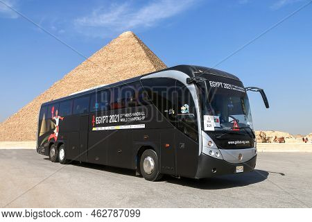 Giza, Egypt - January 26, 2021: Egyptian Coach Bus Mcv 600 At The Background Of The Great Pyramid Of