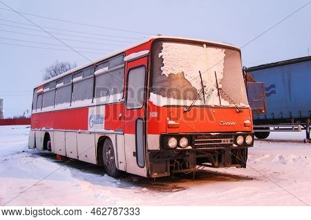 Novyy Urengoy, Russia - December 5, 2012: Abandoned And Snow Covered Old Coach Bus Ikarus 256 In The