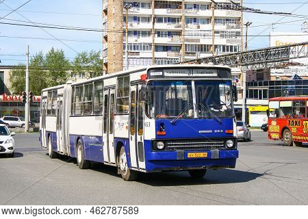 Ekaterinburg, Russia - May 8, 2010: Articulated Urban Bus Ikarus 283.10 In The City Street.