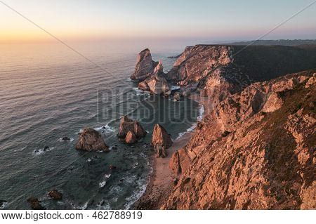 Picturesque Drone View Of Wild Praia Da Ursa Beach With Massive Rocky Cliffs And Sandy Coastline Aga