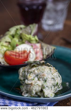 Closeup Of A Rustic Spinach Dumpling With Salad