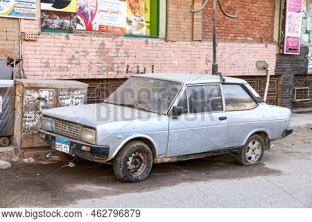 Giza, Egypt - January 26, 2021: Old Cyan Car Fiat 131 In A City Street.