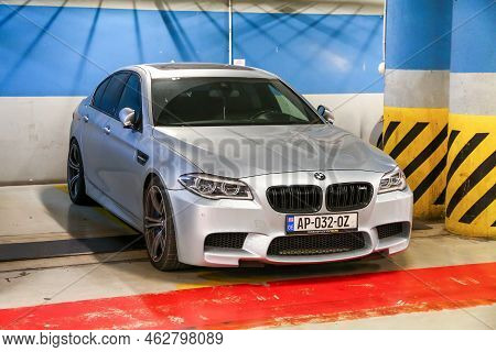 Tbilisi, Georgia - October 10, 2021: Luxury Sports Car Bmw M5 (f10) In The Underground Parking.