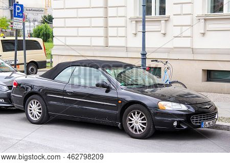 Berlin, Germany - September 12, 2013: Black Convertible Car Chrysler Sebring In The City Street.