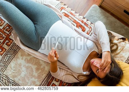 Pregnant Temperature Fever Check. Pregnancy Woman Holding Thermometer, Check Fever Flu Temperature. 