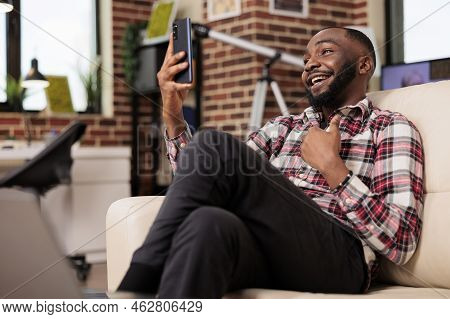 Office Worker Using Online Smartphone Videocall To Talk To People On Videoconference Chat. Working F