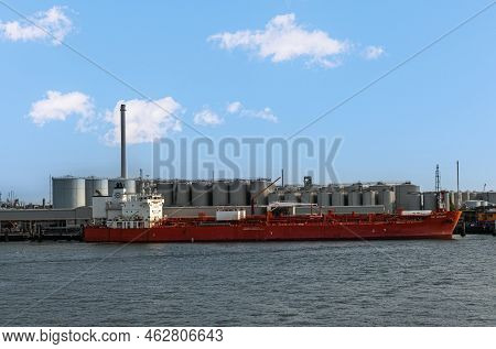Rotterdam, Netherlands - July 11, 2022: Red Trf Bergen Norvegian Tanker Docked At Gas Terminal Under