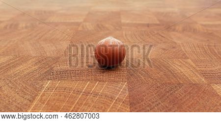Close Up Huzelnut On Wooden Table Background.