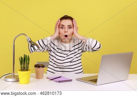 Amazed Shocked Woman Office Manager Looking At Camera With Big Eyes And Open Mouth, Keeps Hands On H