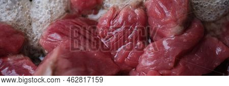 Raw Cuts Of Beef Meat Being Prepared For Delicious Dinner Closeup. Healthy Food Concept