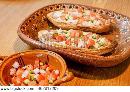 Mexican Molletes, Traditional Food With Bread, Beans, Cheese, Tomato And Chili