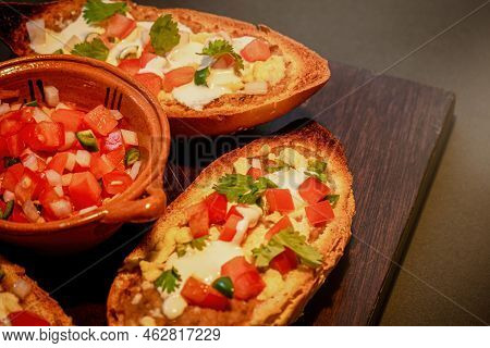 Mexican Molletes, Traditional Food With Bread, Beans, Cheese, Tomato And Chili