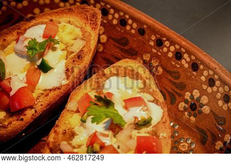 Mexican Molletes, Traditional Food With Bread, Beans, Cheese, Tomato And Chili