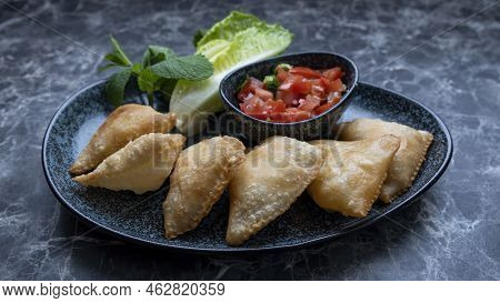 Samosa Is A Fried Or Baked Pastry With A Savory Filling, Such As Spiced Potatoes, Onions, Peas, Chee