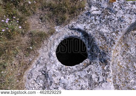 The Ancient Cave City Of Bakla, Outside View. Round Grain Pits For Grain Storage.