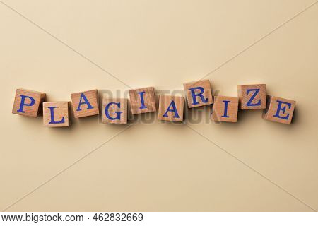 Wooden Cubes With Word Plagiarize On Beige Background, Flat Lay